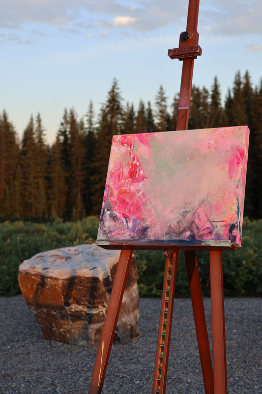 “Where No Words Were” – original textured acrylic painting by Olia Nychyporenko (artbyOliaN), displayed outdoors on an easel. Abstract expressionist work in soft pinks and muted greens, with layered emotion.